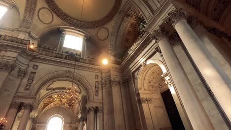 visitors admire architecture inside st. paul's cathedral