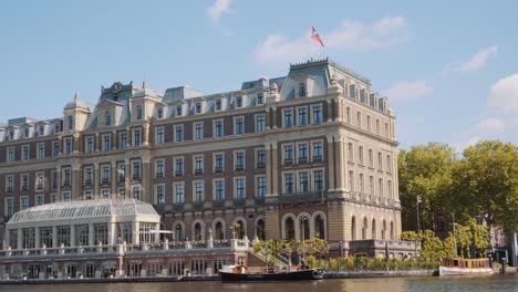 amstel hotel - boat cruising at amstel river near intercontinental amstel amsterdam hotel in netherlands