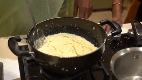 making shira indian sweet for pooja rituals and added some milk