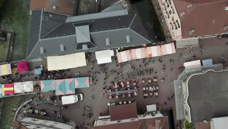 Crowds-of-People-and-Street-Market-Vendors-in-Annecy,-France---Aerial