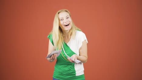 Woman-counting-money-looking-at-camera.