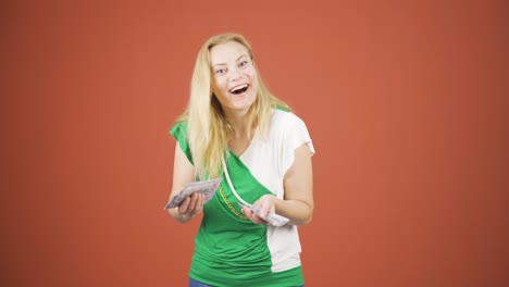 woman counting money looking at camera.