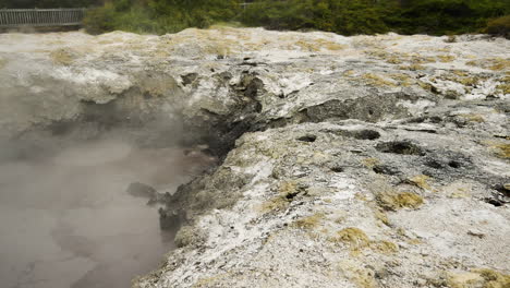 close up of bubbling hot springs at wai-o-tapu national park during daytime - volcanic geothermal area in new zealand