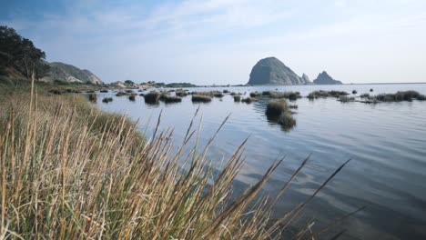 Epic-rock-formation-from-a-distant-shore