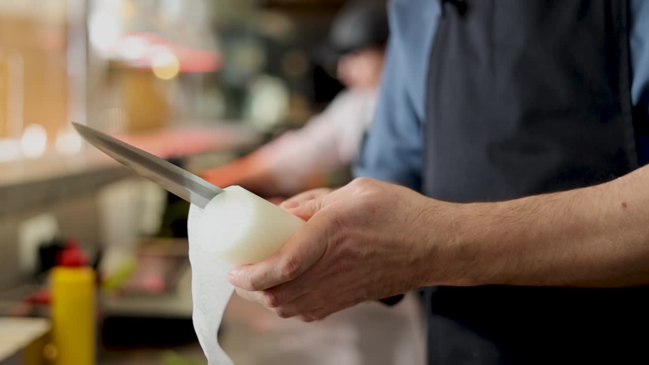 Chef preparing a radish