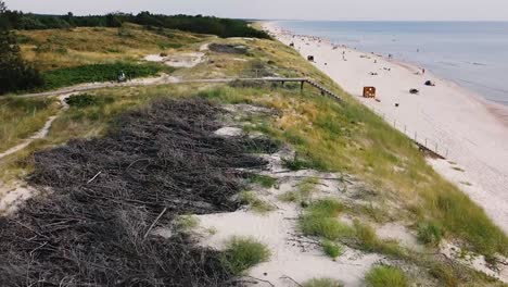 aerial shot of dunes next to the sea side