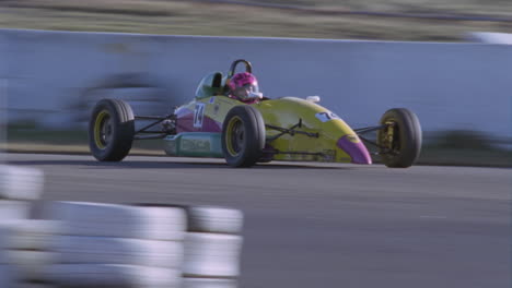 a race car heads into a turn on a race track