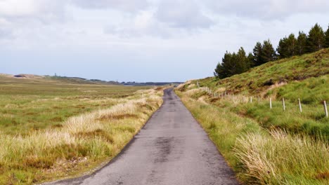 shot of a single track road on the moorland of the isle of lewis