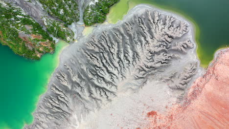 Scenic-view-Spinning-shot-Grey-Sand-Blue-Green-Lake-Ocher-Ground-close-Volcano-Caldera-Chaiten-Chile