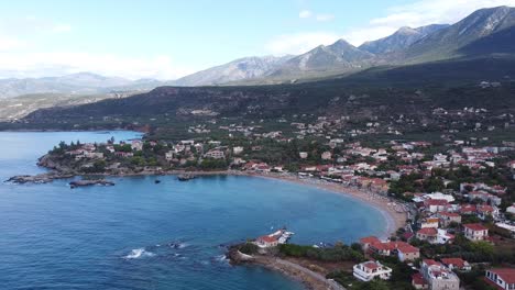 Stoupa-Beach-Town-during-Late-Summer-at-Peloponnese,-Greece---Aerial-Forward