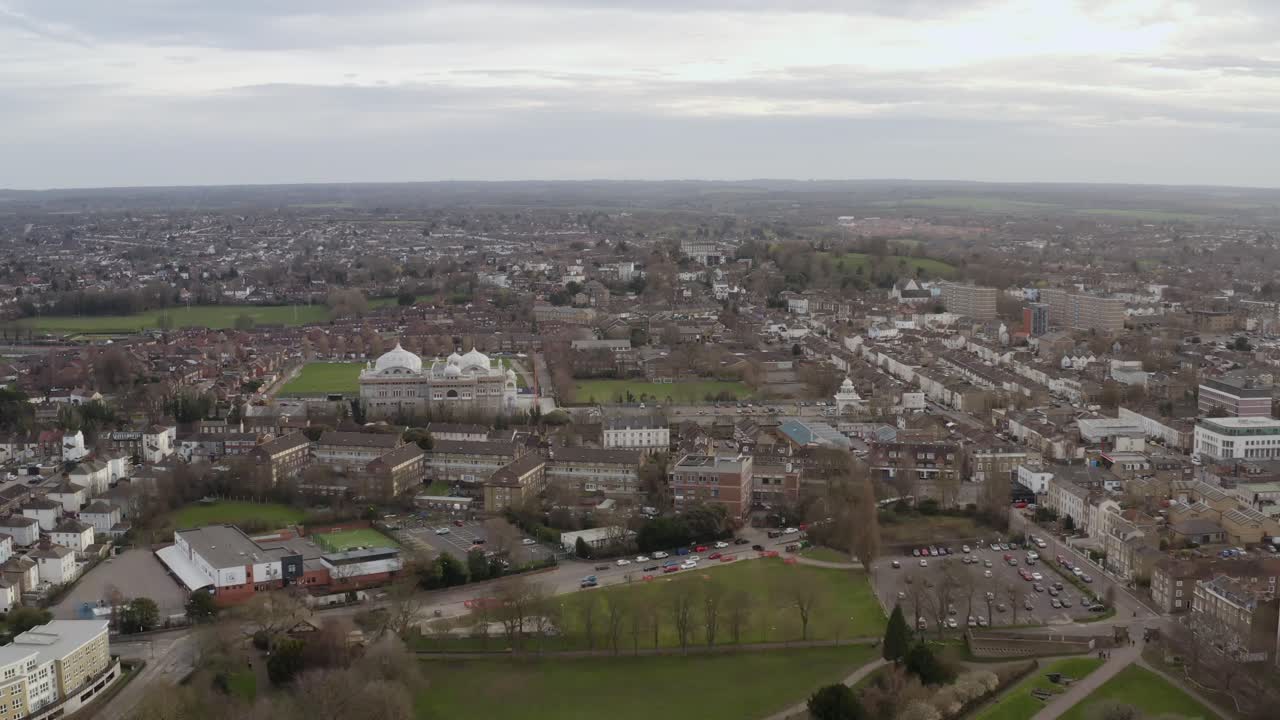 Aerial of Gravesend showing rooftops, streets and distant Thames estuary below
