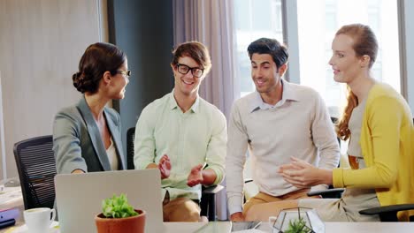 Coworkers-applauding-a-colleague-after-presentation