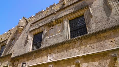 coats of arms carved on the stone wall on the street of the knights on the island of rhodes, greece