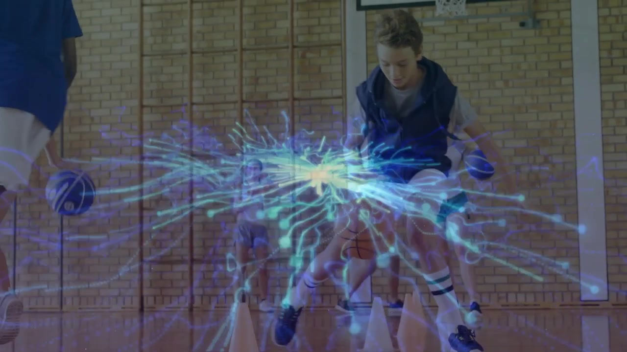 Young Basketball Players Practicing Drills in Indoor Gym with Digital Graphics