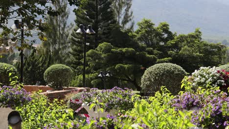 cherub statue in a lush garden setting