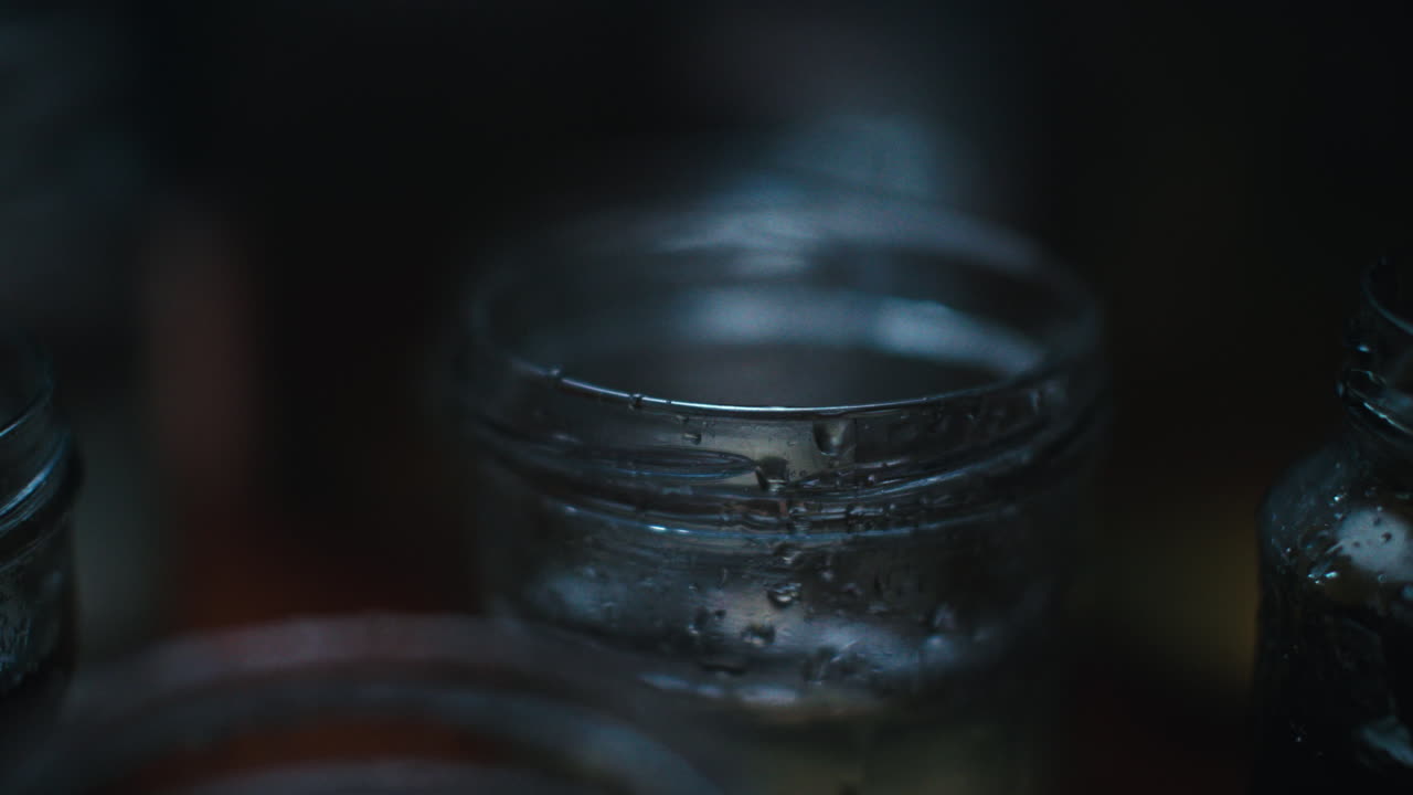 Water driping on glass jars