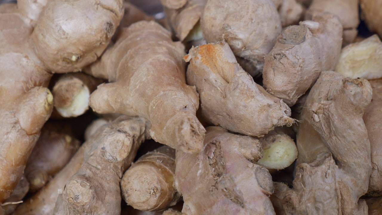 Close-up of Fresh Ginger Roots Piled Together