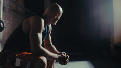 man resting in the gym