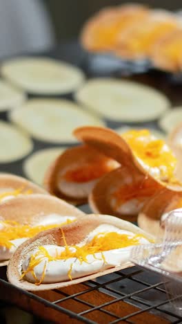cooking thai pancakes at bangkok's floating market
