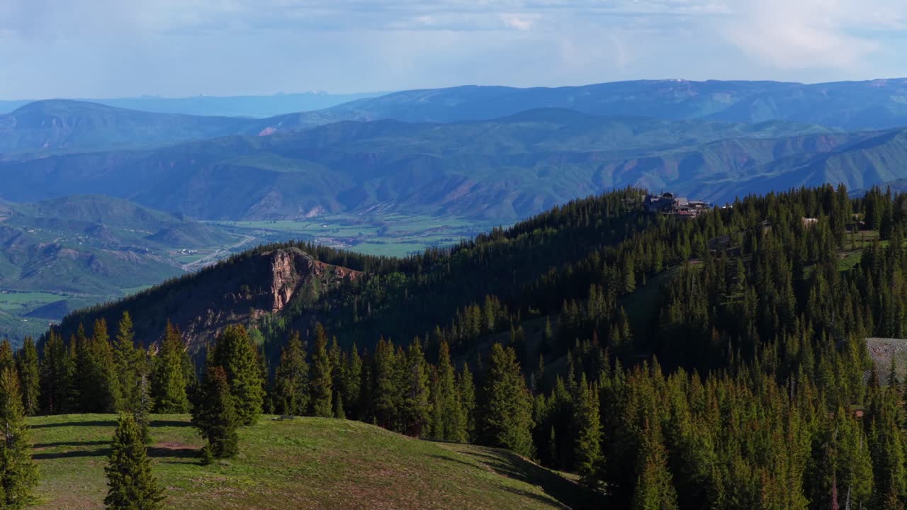 Spring summer Aspen Gondola Little Annie Basin Trailhead AJAX top of Aspen Mountain aerial drone melting snow Rocky Mountains morning sunny blue sky Silver Bell Trailhead Richmond Hill circle right
