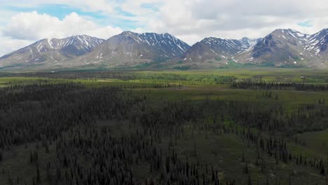 4K-Drone-Video-of-Mountain-Peaks-and-Granite-Creek-near-Denali-National-Park-in-Alaska-on-Sunny-Summer-Day