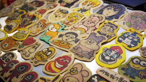 amazing street food pancake artist makes a colorful variety of edible cartoon characters in bangkok thailand's famous night market