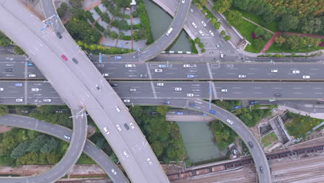 aerial photography of urban atmosphere viaduct busy multilevel interchange overpass in shanghai showing morning traffic flow coming from the elevated roads