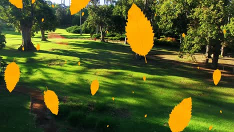 Digital-composition-of-multiple-autumn-leaves-icons-falling-against-aerial-view-of-the-park