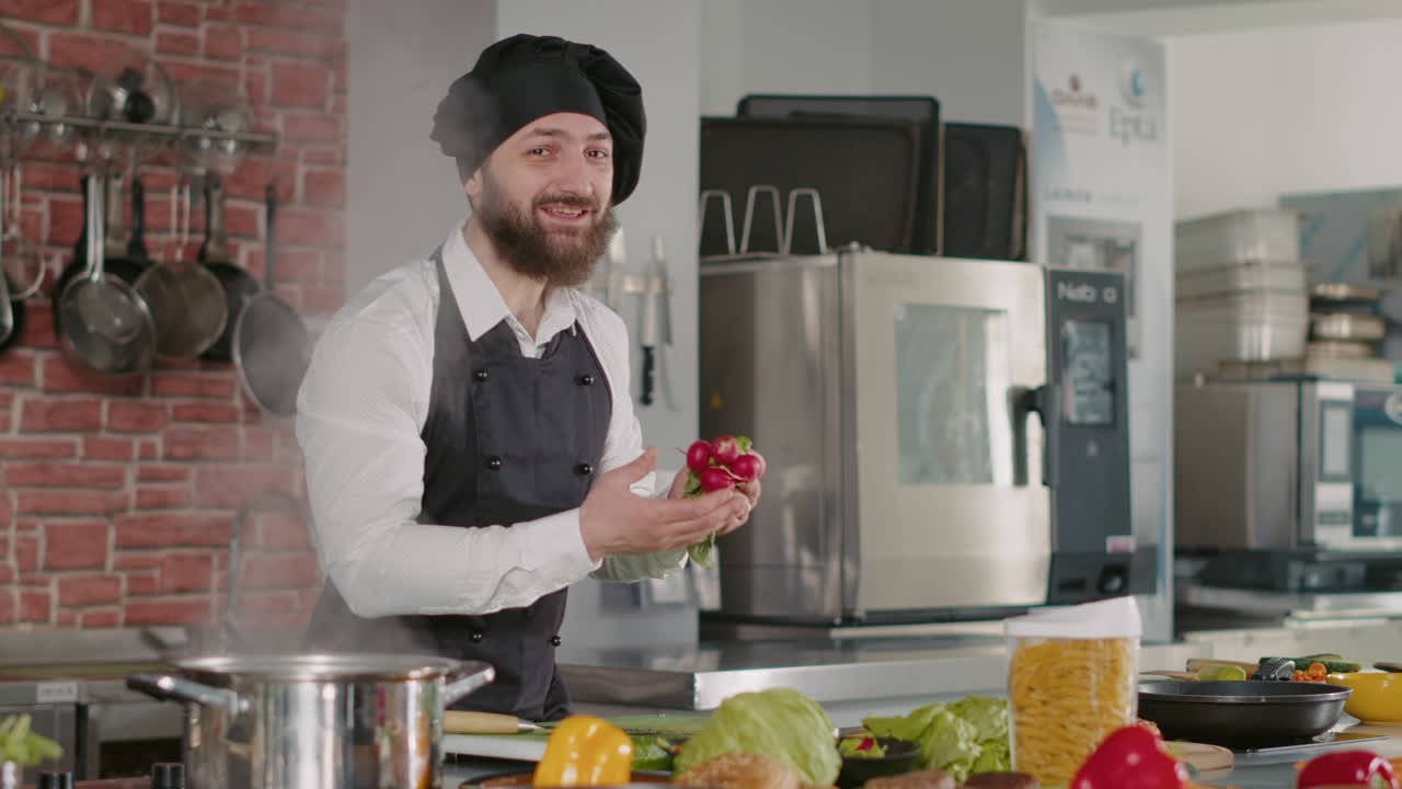 POV of man hosting cooking show vlog in restaurant kitchen