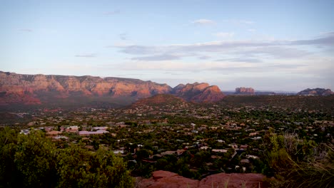 the majestic view of red rock mountains catching pink light over sedona