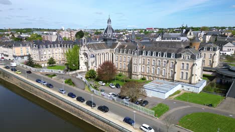 hospital building and riverside, chateau gontier in france