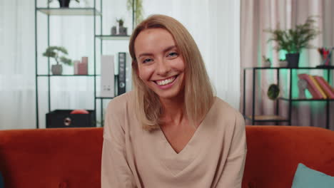 close-up portrait of happy smiling caucasian woman in shirt, looking at camera, celebrate good news