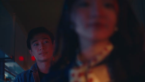 young couple at night in fish market