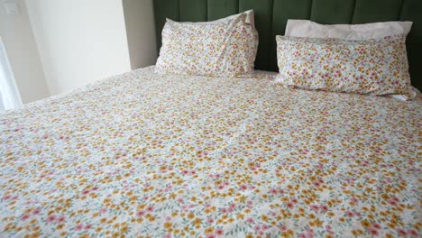 floral bedding on a bed