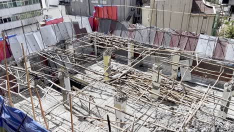 stick and bamboo scaffolding in use at construction site in ethiopia