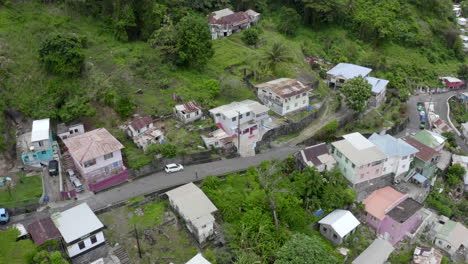 Establishing-shoot-on-Kingstown,-Saint-Vincents-capital-city-sliding-right---slowly-increasing-hight-and-revealing-populated-area-on-top-of-the-mountain