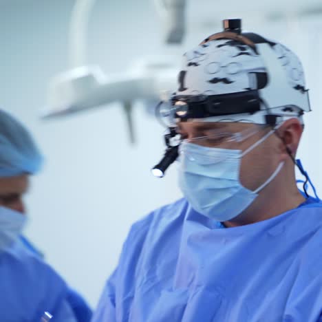surgery in clinic. professional doctors in blue medical uniform conduct an operation in the hospital. healthcare concept