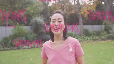 animation of survivors text in pink over happy woman in garden wearing breast cancer ribbon