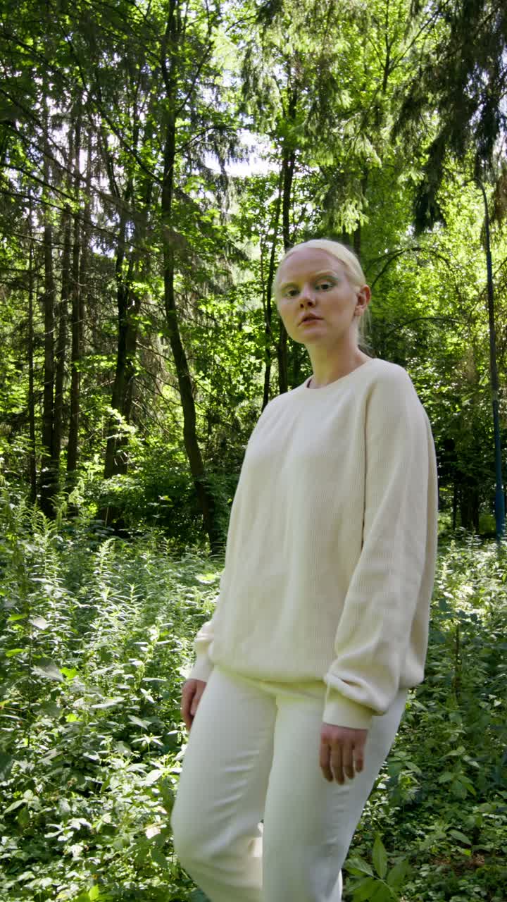 Woman in white clothing in the forest