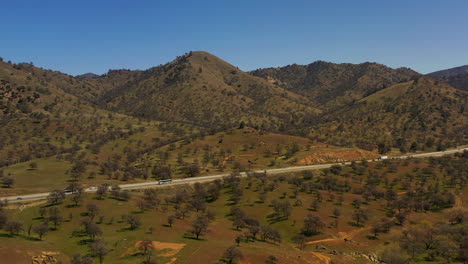 Highway-traffic-through-the-picturesque-Tehachapi-mountain-range---aerial-view