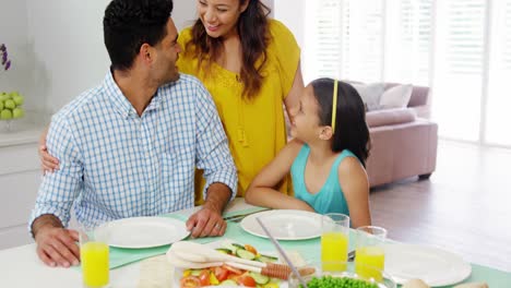 Happy-family-having-lunch-together