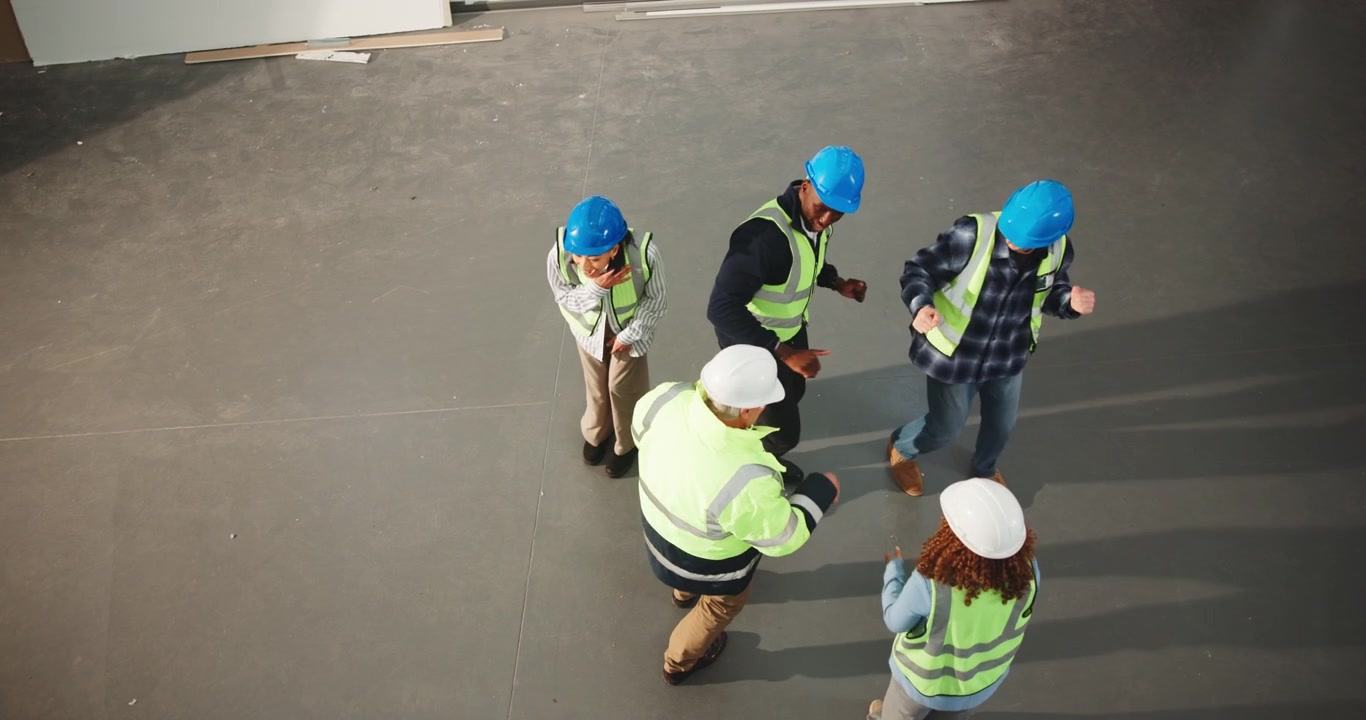 Diverse Construction Workers Dancing Together on Site