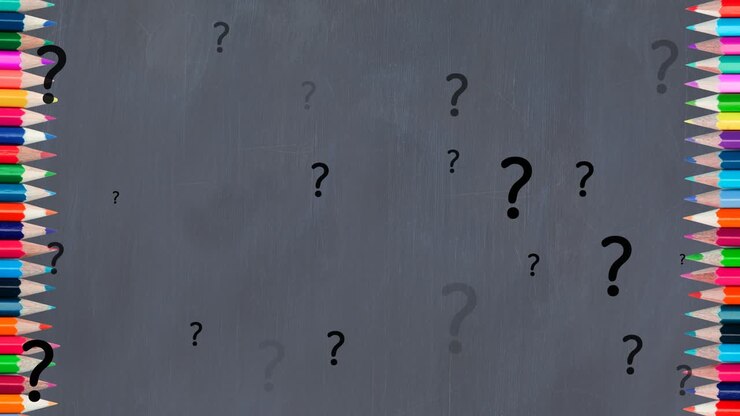 animación de signos de interrogación sobre lápices de colores sobre un fondo gris