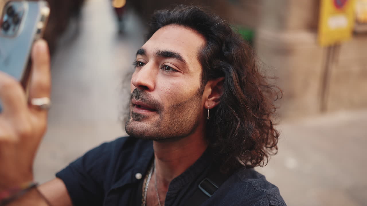 Man taking a selfie on a city street