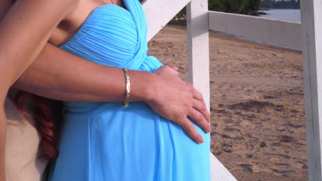 pregnant belly hands. pregnant belly closeup. pregnant couple holding belly
