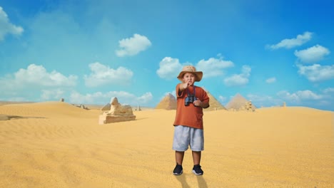 asian boy with a hat and binoculars pointing his finger towards you and furiously speaking against blaming you while traveling in giza pyramid. boy researcher, travel adventure, full body