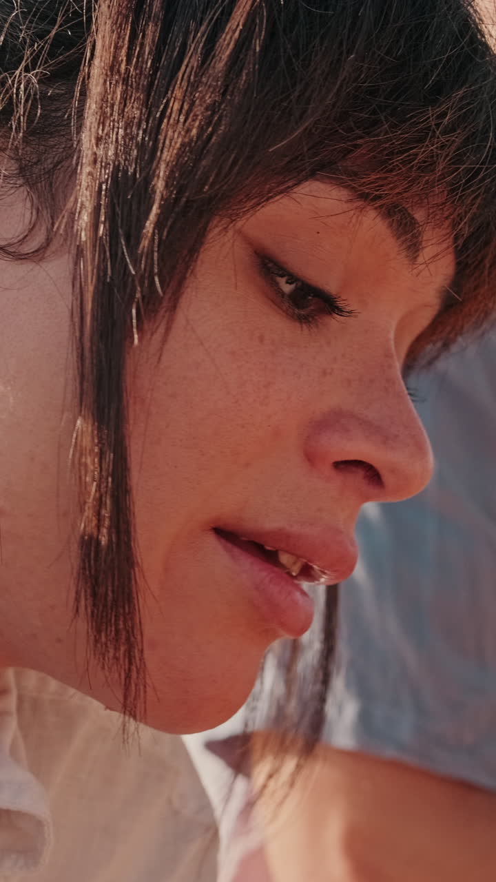 Friends Enjoying a Picnic in Golden Sunlight, focus on the young girl