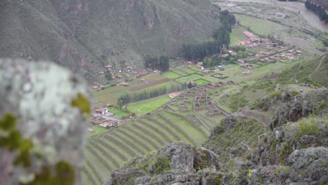 pisac ruins in sacred valley peru, revealing old ancient empire built on platforms in green andes mountains peru