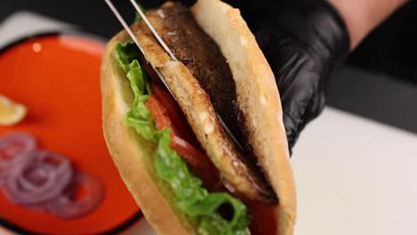 grilled fish sandwich being prepared