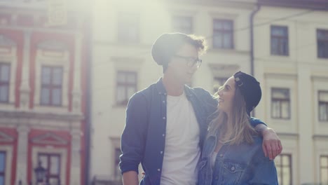 portrait shot of happy hipster couple hugging